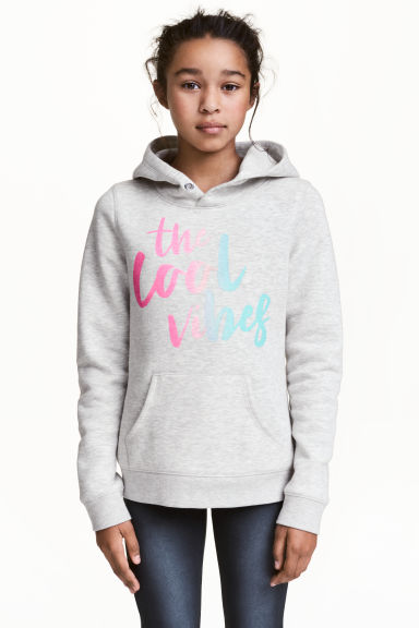 Hooded top with a text motif